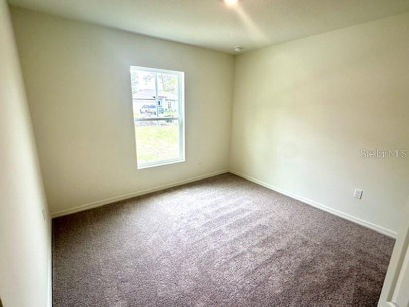 9 Ripton Place Palm Coast, FL 32164 - Photo 11 of 14 an empty room with a window