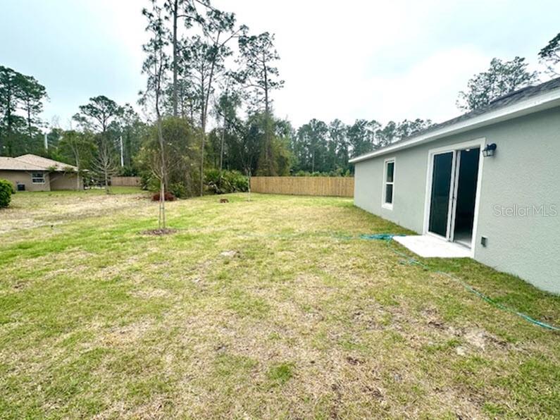 9 Ripton Place Palm Coast, FL 32164 - Photo 12 of 14 a view of a backyard of the house