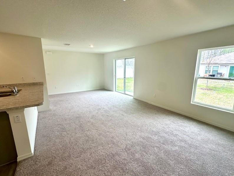 9 Ripton Place Palm Coast, FL 32164 - Photo 5 of 14 an empty room with windows