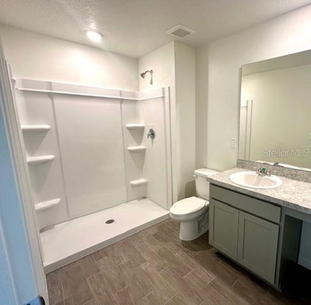9 Ripton Place Palm Coast, FL 32164 - Photo 7 of 14 a bathroom with a granite countertop sink toilet and shower