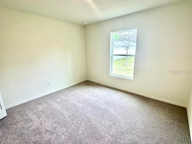 9 Ripton Place Palm Coast, FL 32164 - Photo 10 of 14 an empty room with a window