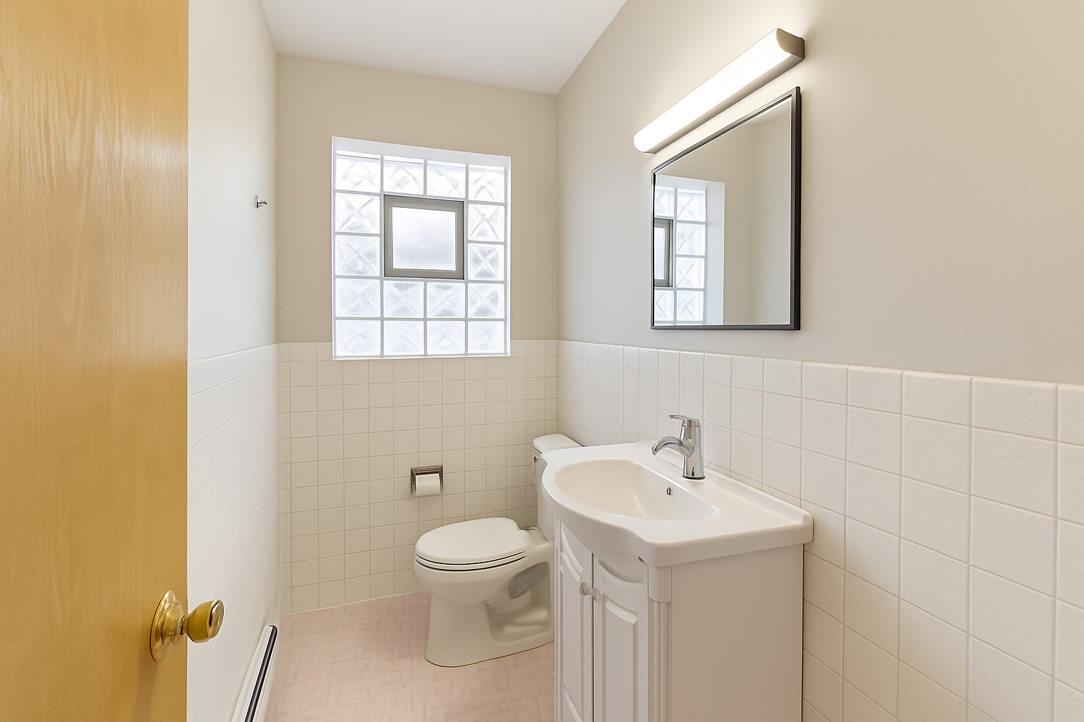 4900 Ridgewood Avenue Norridge, IL 60706 - Photo 6 of 9 a bathroom with a toilet sink and mirror