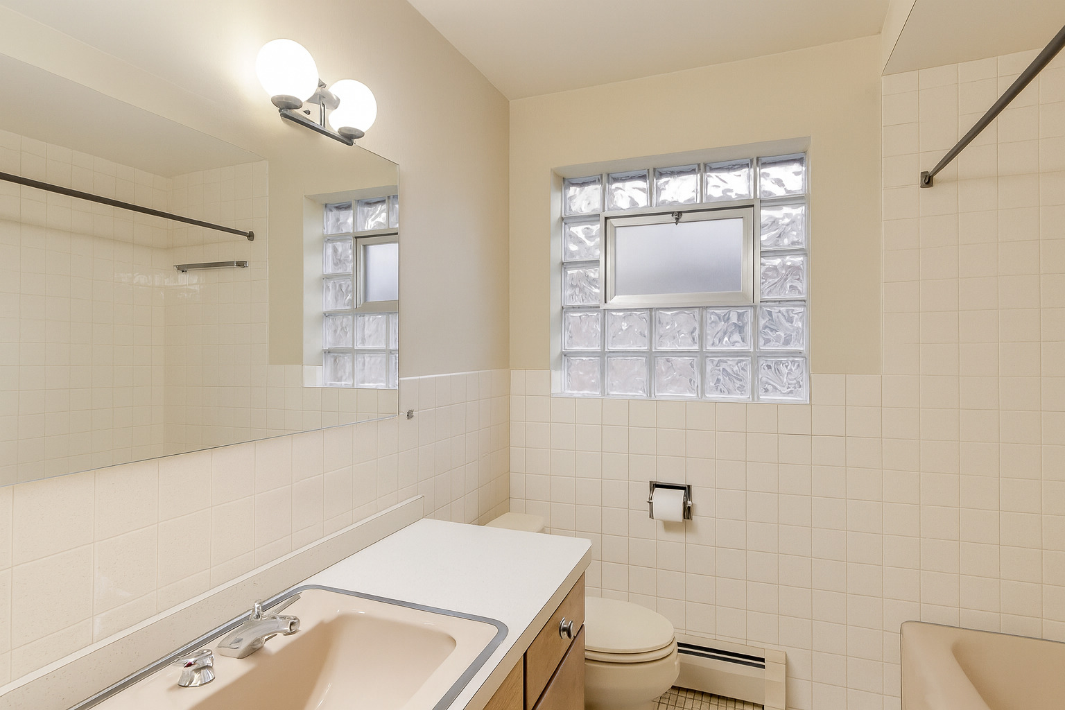 4900 Ridgewood Avenue Norridge, IL 60706 - Photo 7 of 9 a bathroom with a sink a toilet and shower
