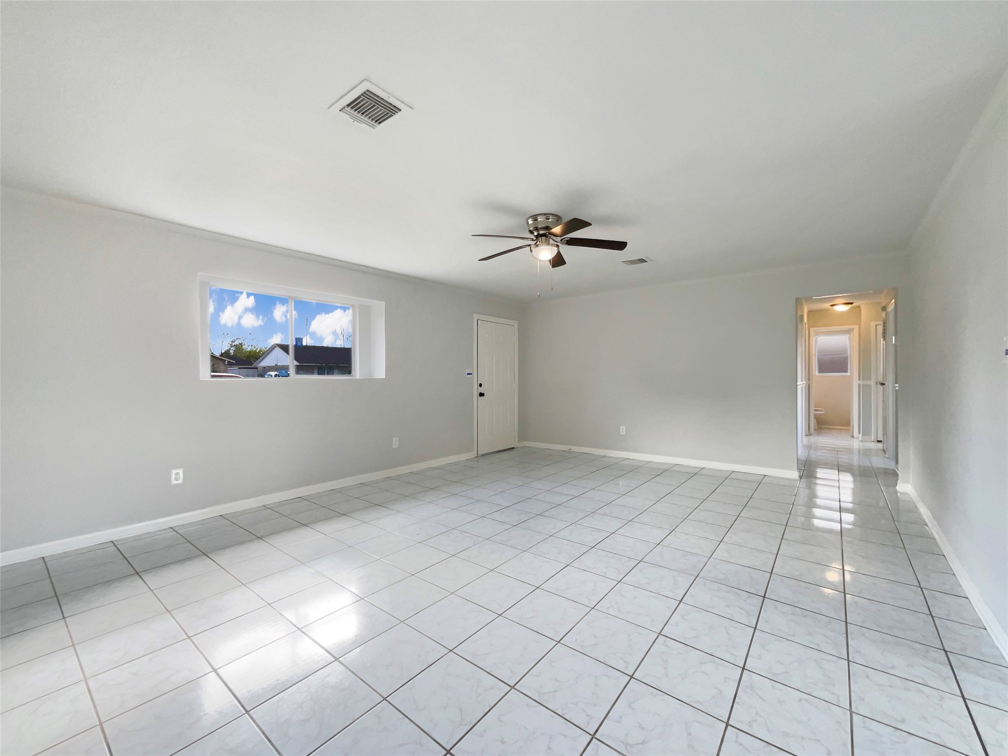 205 Bastrop Street Angleton, TX 77515 - Photo 8 of 18 a view of an empty room and window