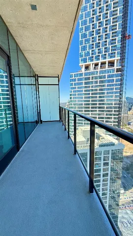 a view of balcony with window and stairs