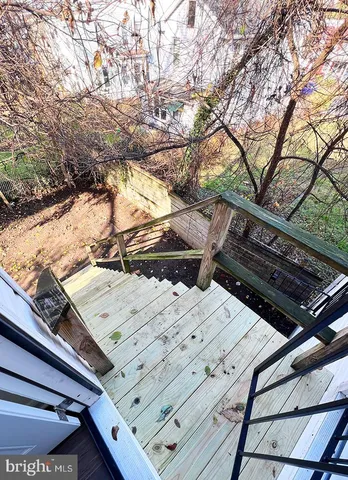 a view of a backyard and floor to ceiling window