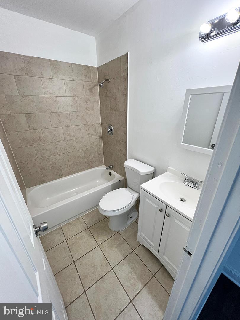 2011 16th Street Southeast Washington, DC 20020 - Photo 9 of 19 a bathroom with a toilet a sink and bathtub