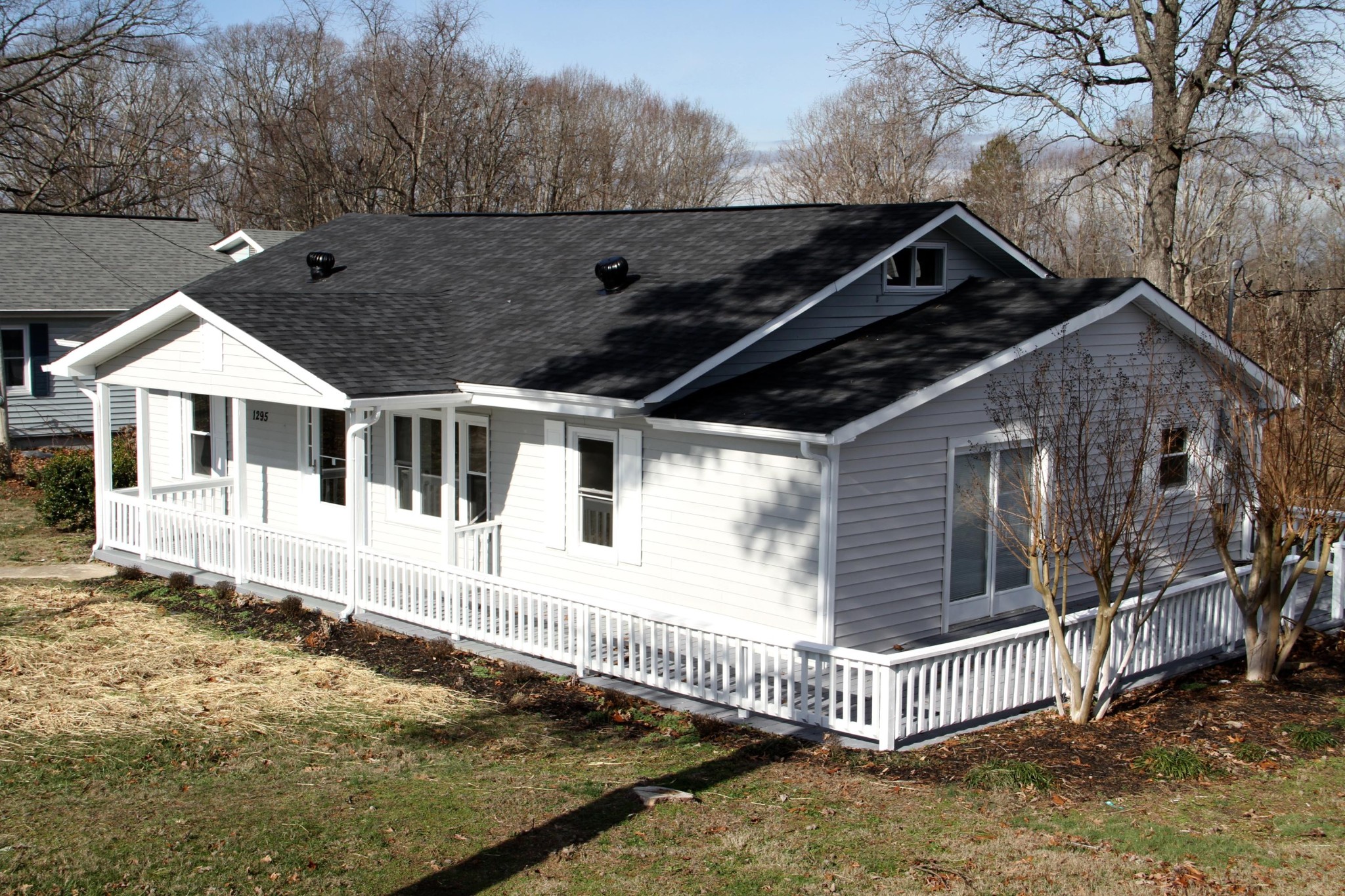 1295 Zion Ridge Road Loudon, TN 37774 - Photo 11 of 40 a white house that has a tree in front of it