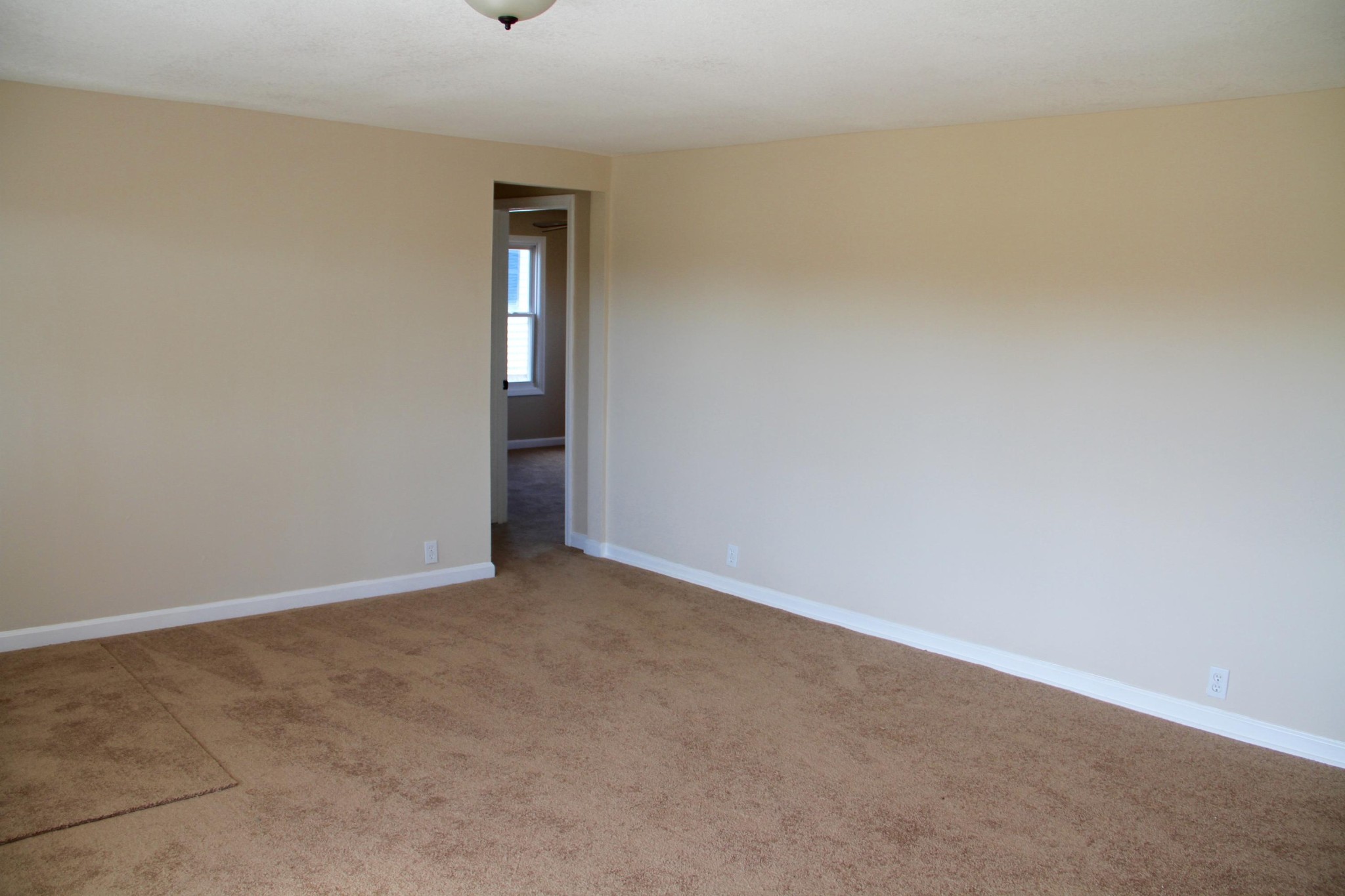 1295 Zion Ridge Road Loudon, TN 37774 - Photo 15 of 40 a view of an empty room with wooden floor and windows