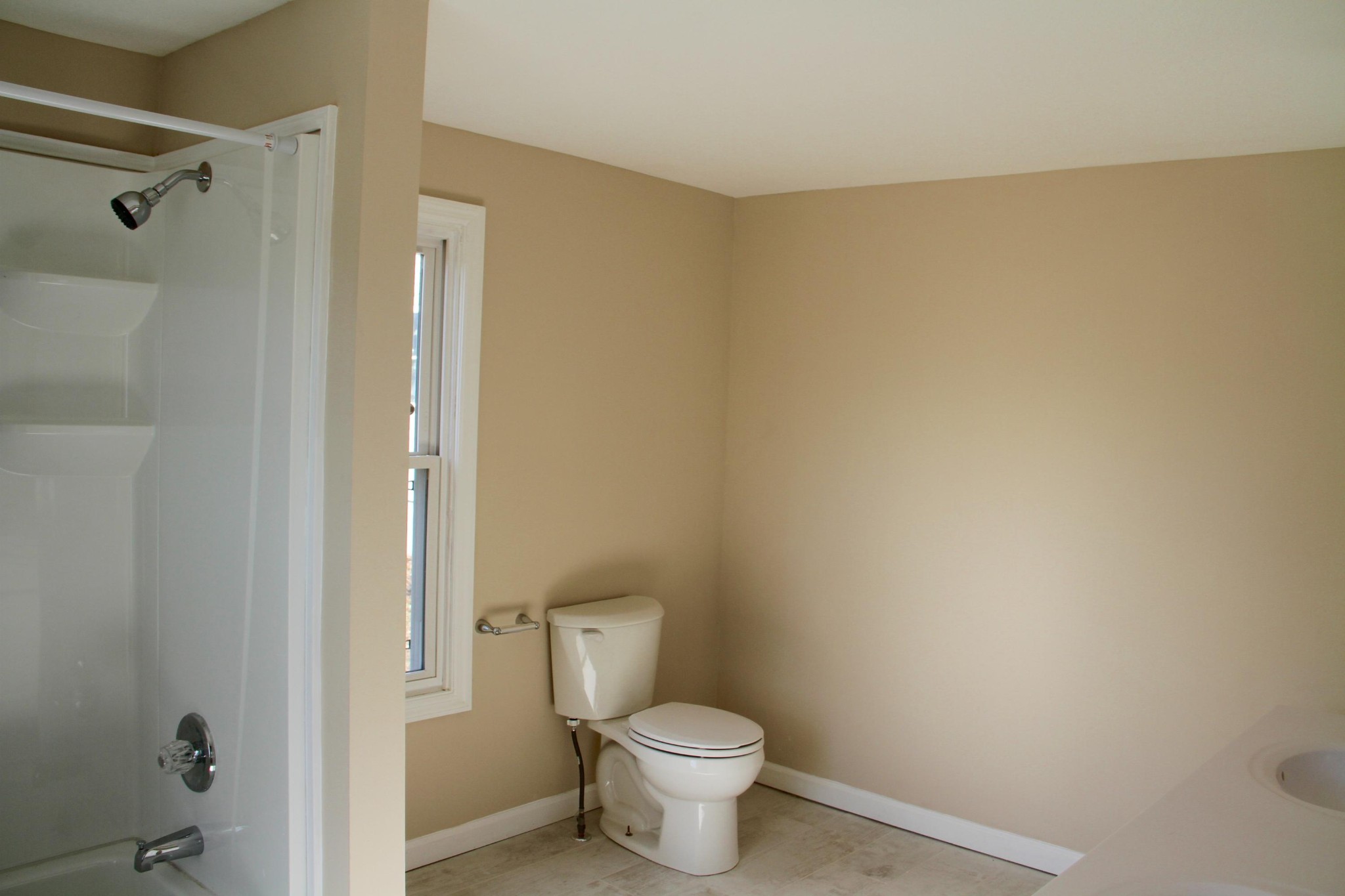 1295 Zion Ridge Road Loudon, TN 37774 - Photo 16 of 40 a white toilet sitting next to a bathroom sink