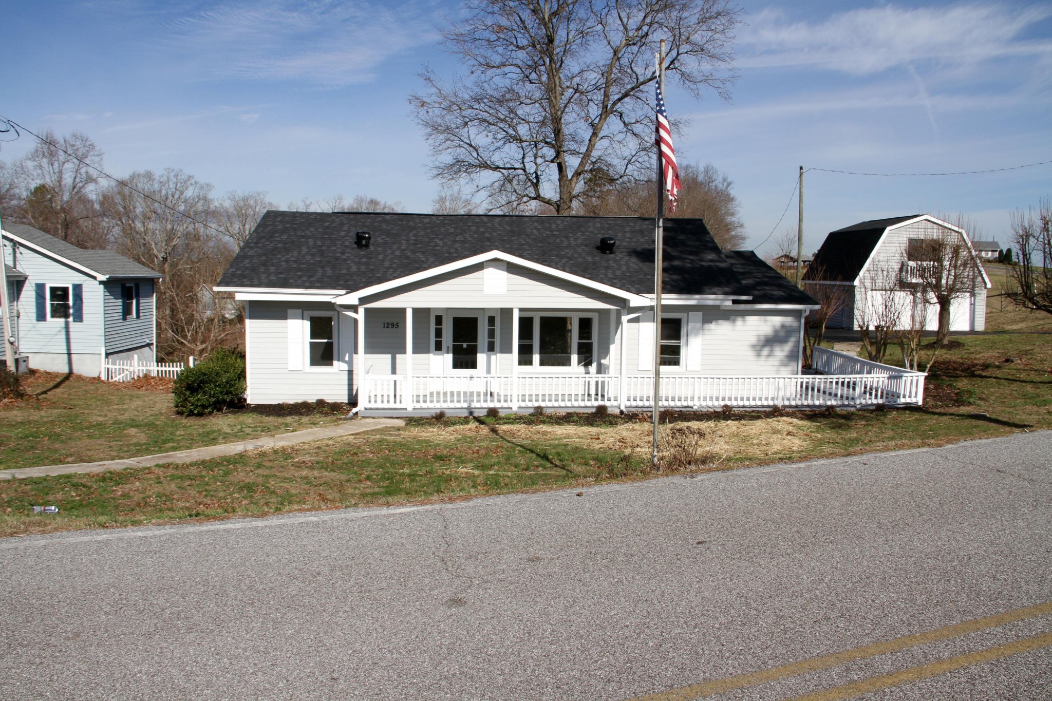 1295 Zion Ridge Road Loudon, TN 37774 - Photo 2 of 40 a front view of a house with a garden and tree