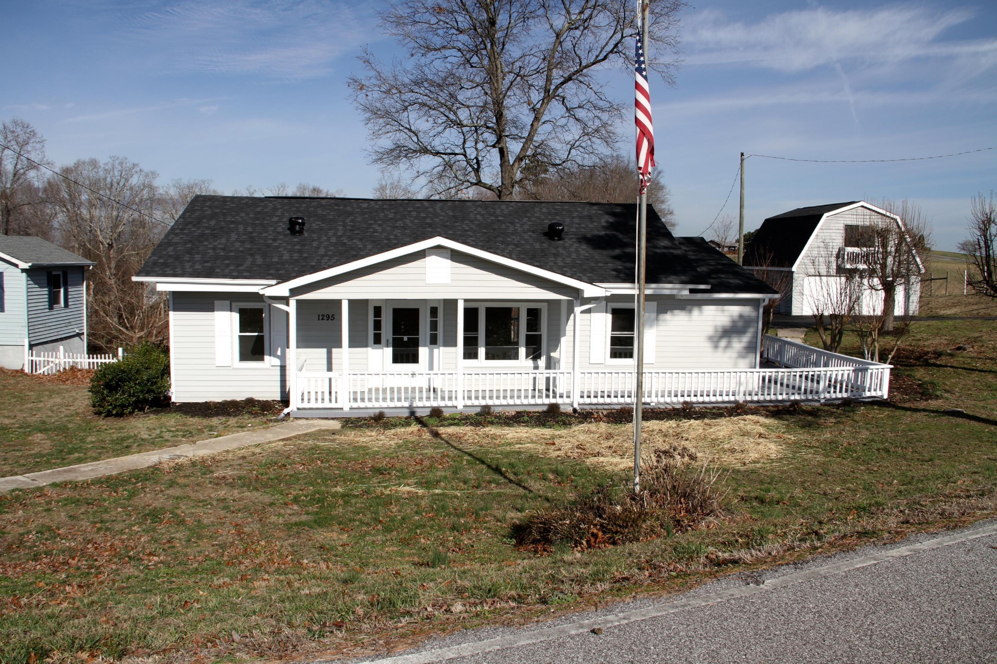 1295 Zion Ridge Road Loudon, TN 37774 - Photo 3 of 40 a front view of a house with garden