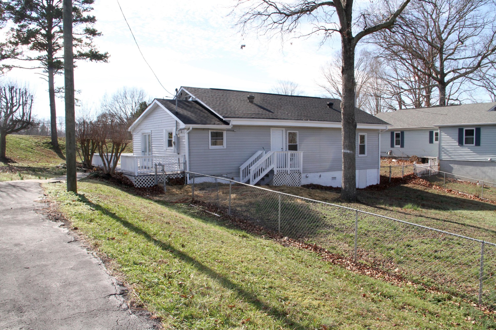 1295 Zion Ridge Road Loudon, TN 37774 - Photo 31 of 40 a view of a house with a yard covered in snow