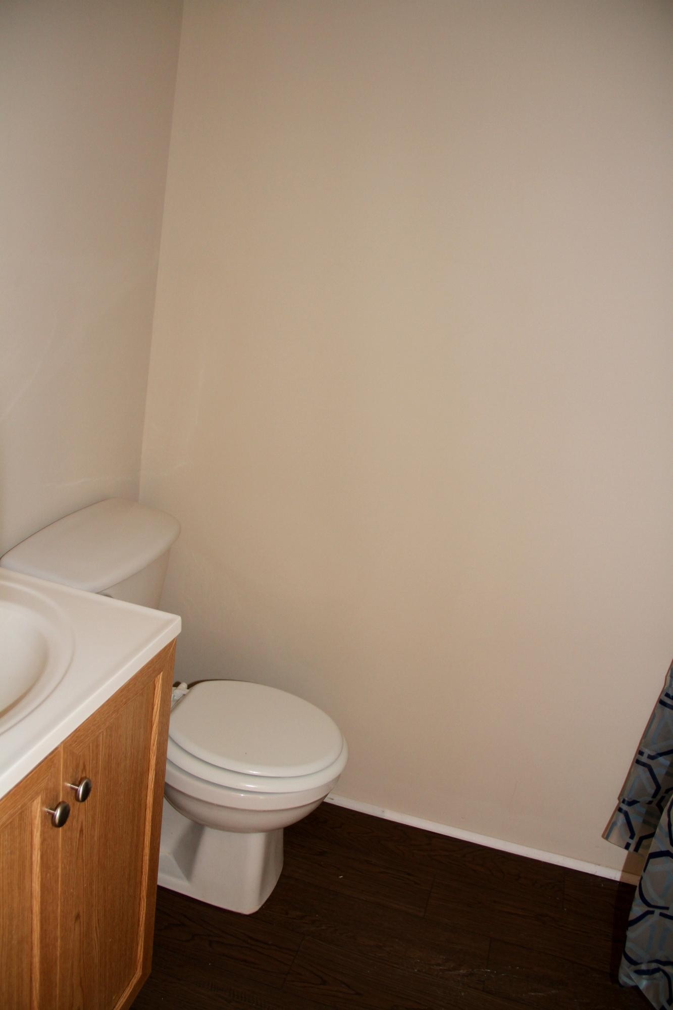 1295 Zion Ridge Road Loudon, TN 37774 - Photo 38 of 40 a white toilet sitting next to a white sink and vanity