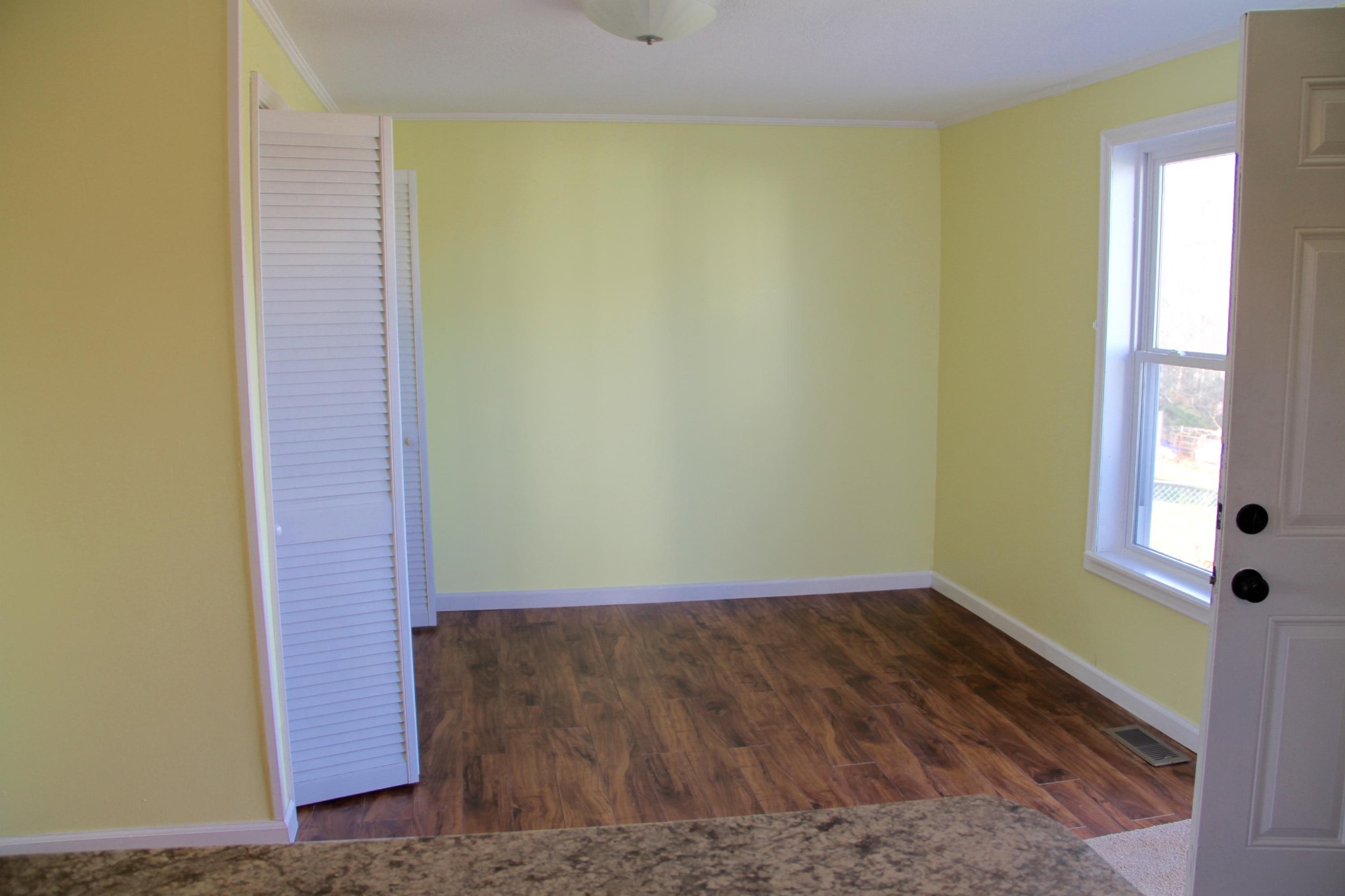 1295 Zion Ridge Road Loudon, TN 37774 - Photo 9 of 40 a view of a small space with wooden floor and a window