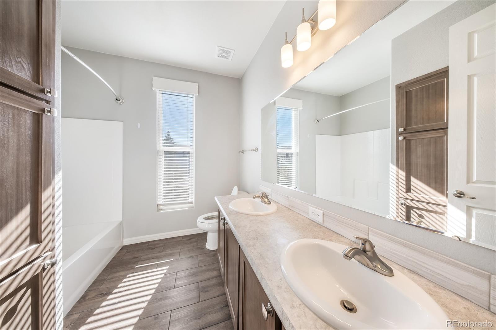 551 Summit Trail Granby, CO 80446 - Photo 22 of 35 a bathroom with a sink and a mirror