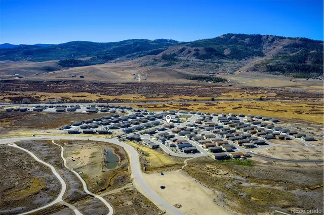 a view of a house with a yard and balcony