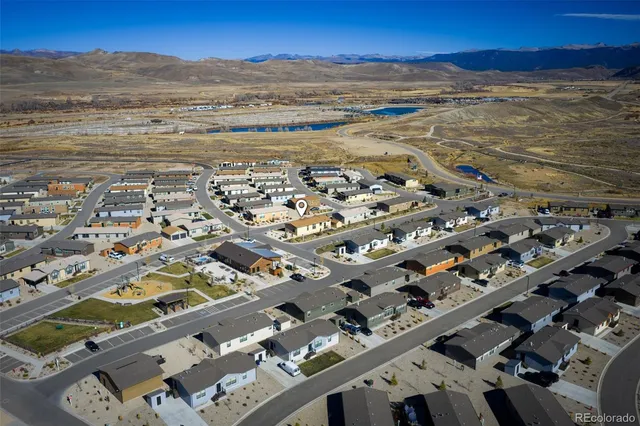 a view of multiple houses with a yard