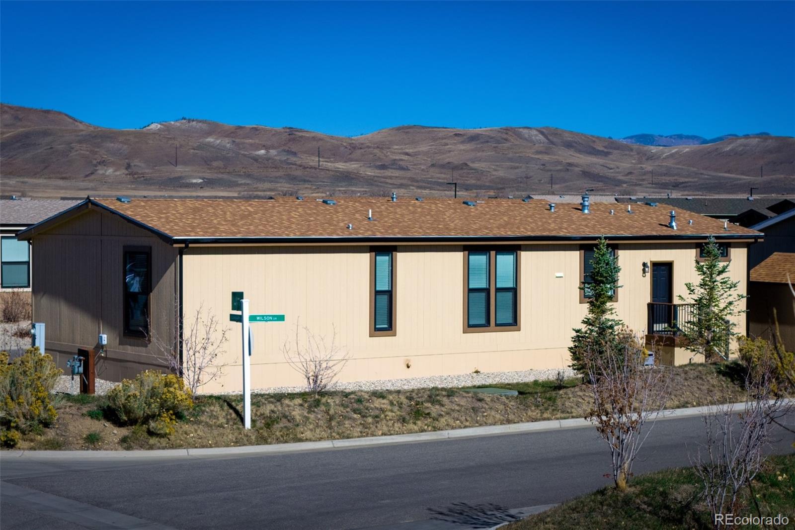 551 Summit Trail Granby, CO 80446 - Photo 28 of 35 a view of a house with a yard and balcony