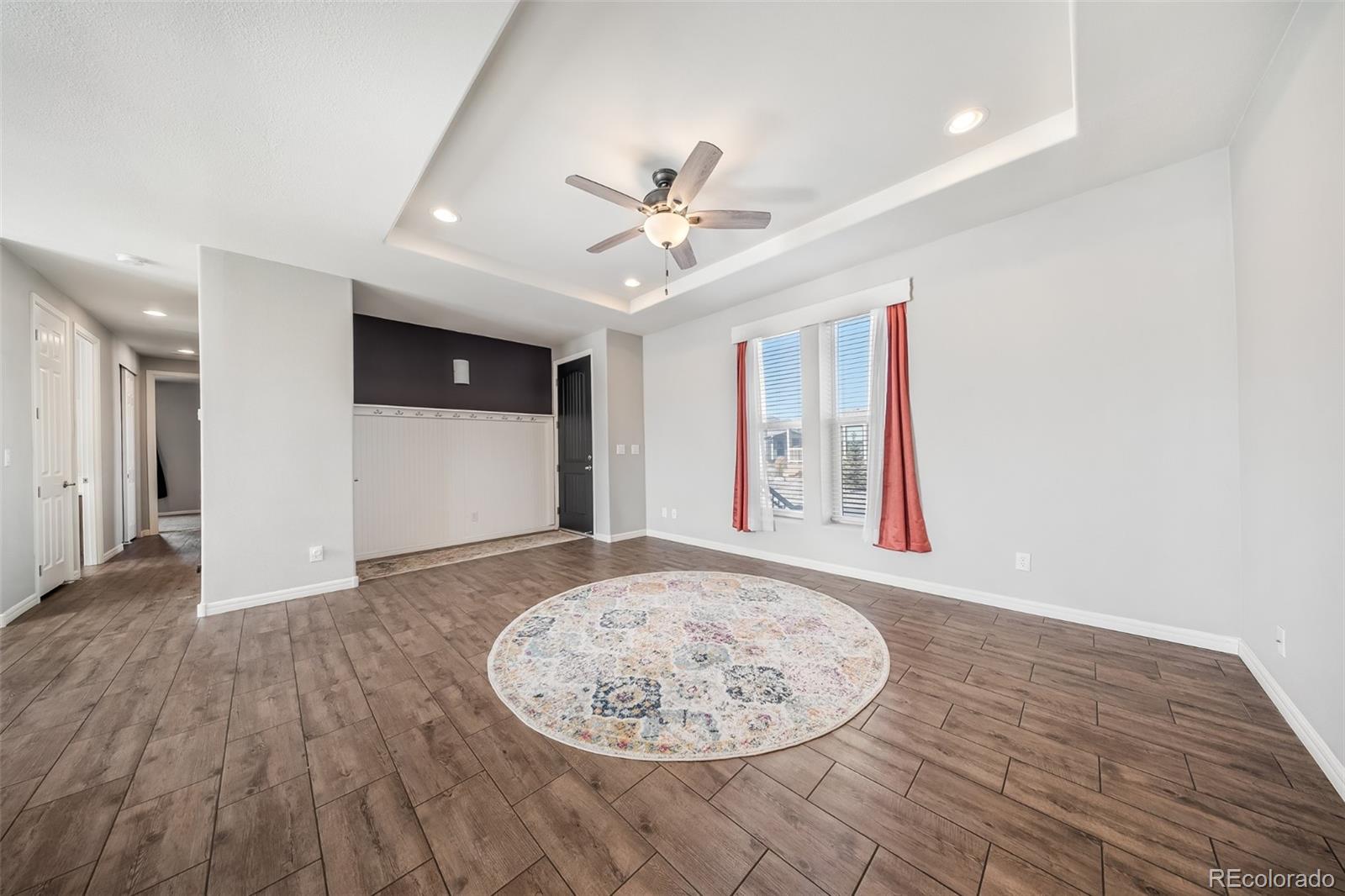 551 Summit Trail Granby, CO 80446 - Photo 4 of 35 wooden floor in an empty room with a window