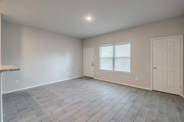 an empty room with windows