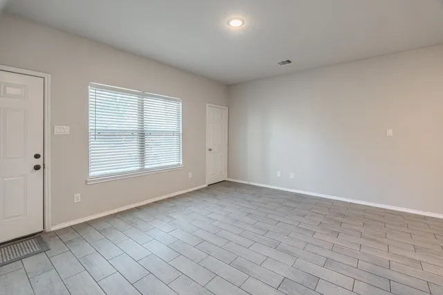 an empty room with windows