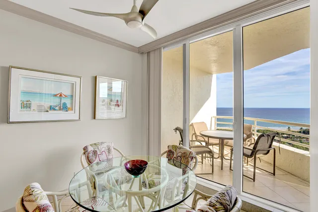 a view of swimming pool with a garden and plants