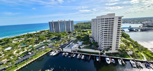 a view of a dining room with furniture large windows and wooden floor