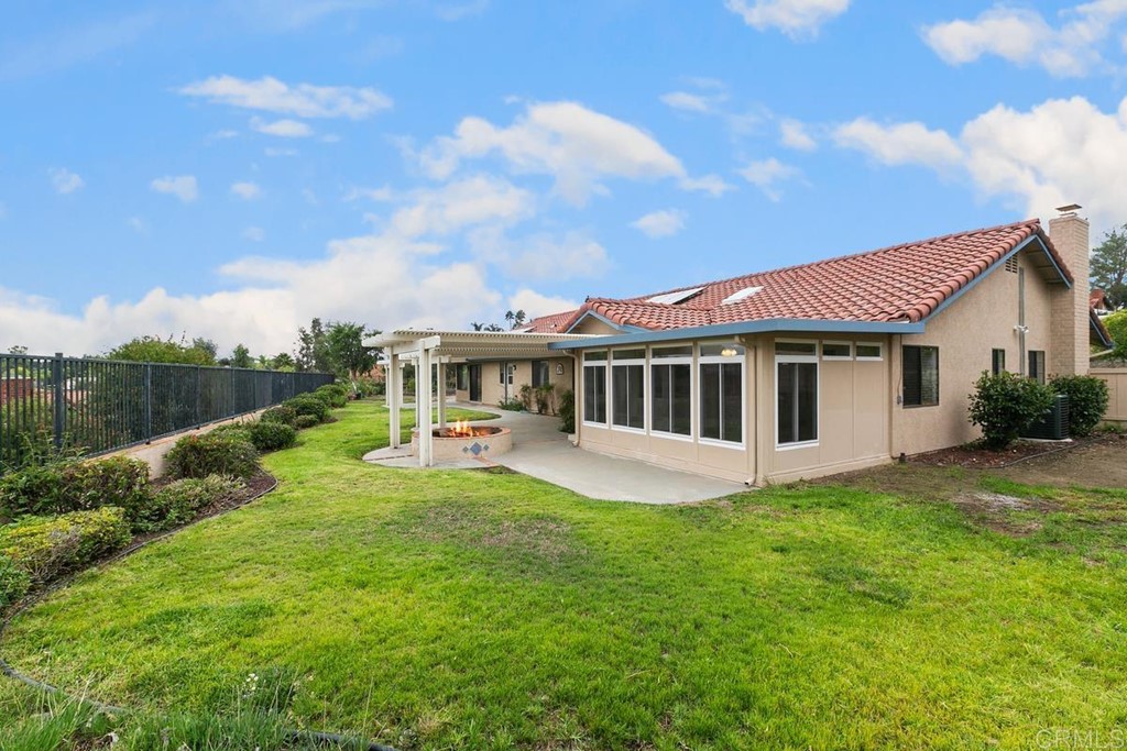 2248 Winsome Place Escondido, CA 92029 - Photo 15 of 26 a view of a house with backyard sitting area and garden