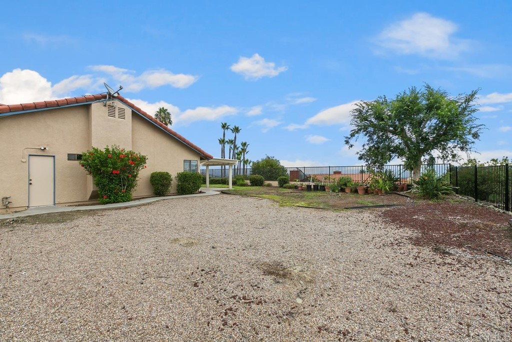 2248 Winsome Place Escondido, CA 92029 - Photo 16 of 26 a view of a house with backyard and trees