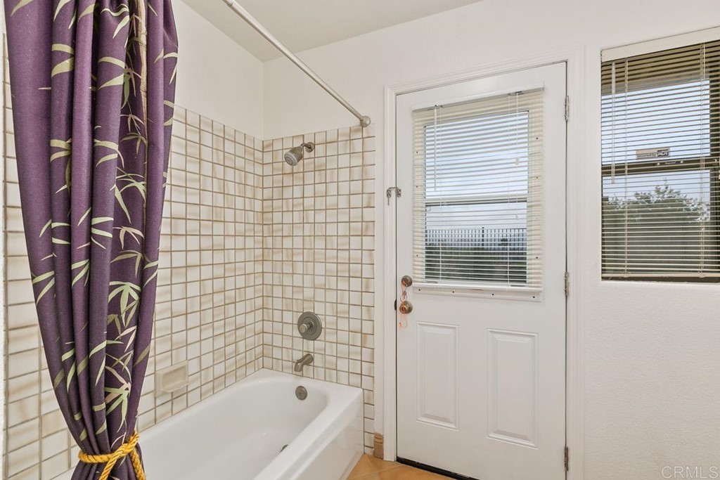 2248 Winsome Place Escondido, CA 92029 - Photo 23 of 26 a bathroom with a bathtub and shower
