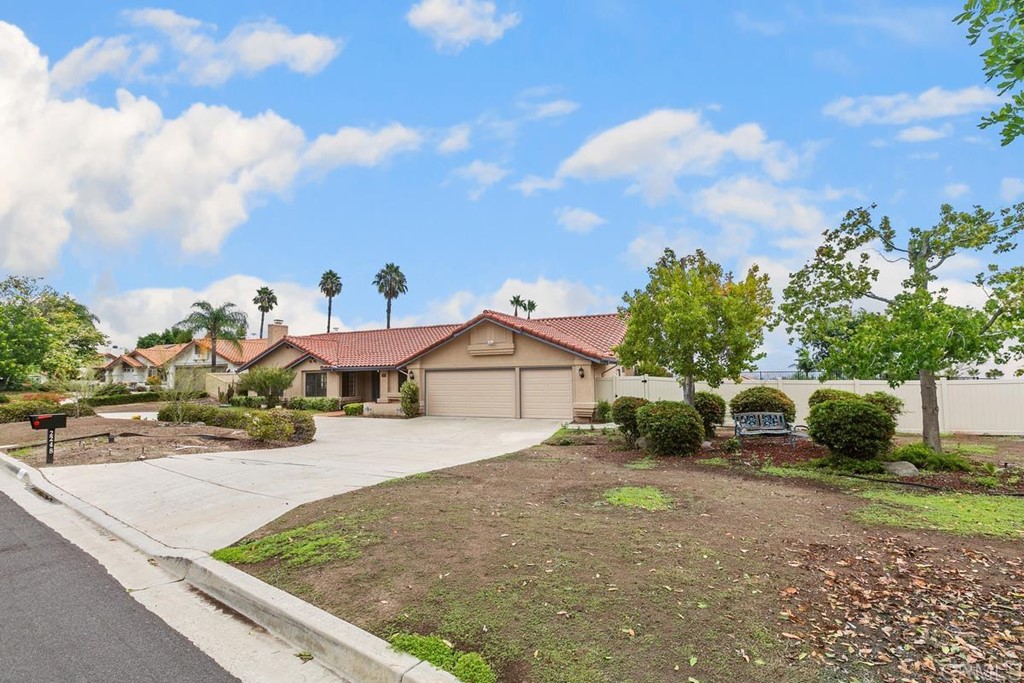 2248 Winsome Place Escondido, CA 92029 - Photo 25 of 26 a view of a house with a yard