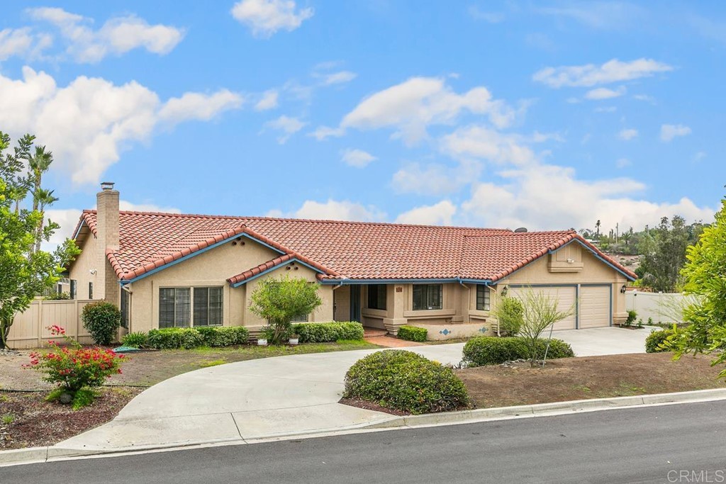 2248 Winsome Place Escondido, CA 92029 - Photo 26 of 26 a front view of a house with a yard and garage
