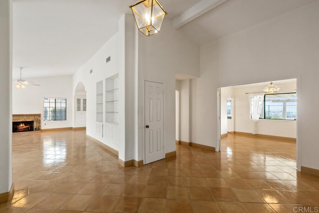 2248 Winsome Place Escondido, CA 92029 - Photo 5 of 26 a view of an empty room with window and wooden floor