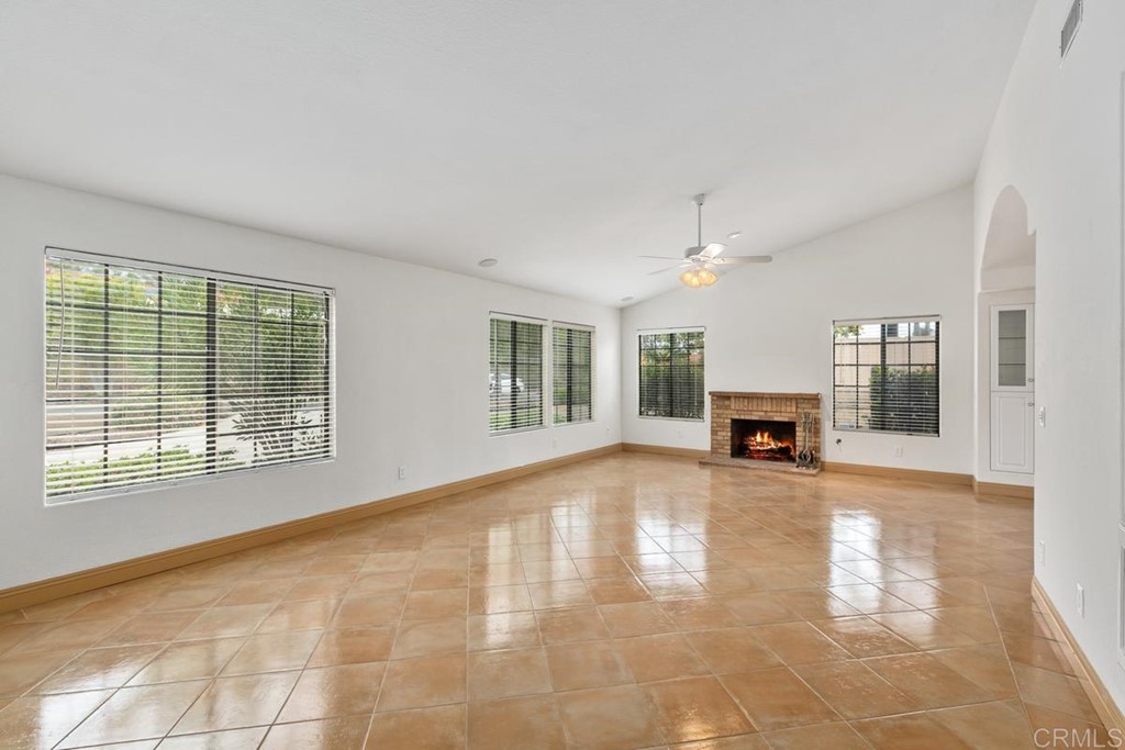 2248 Winsome Place Escondido, CA 92029 - Photo 6 of 26 a view of an empty room with fireplace and a window