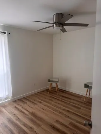 a room with a bench and a window