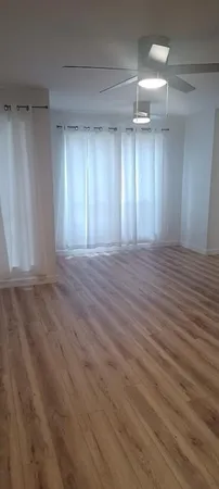 a view of an empty room with a window