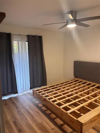 a bedroom with a bed and a mirror