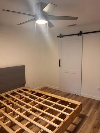 a bedroom with a bed and a shower