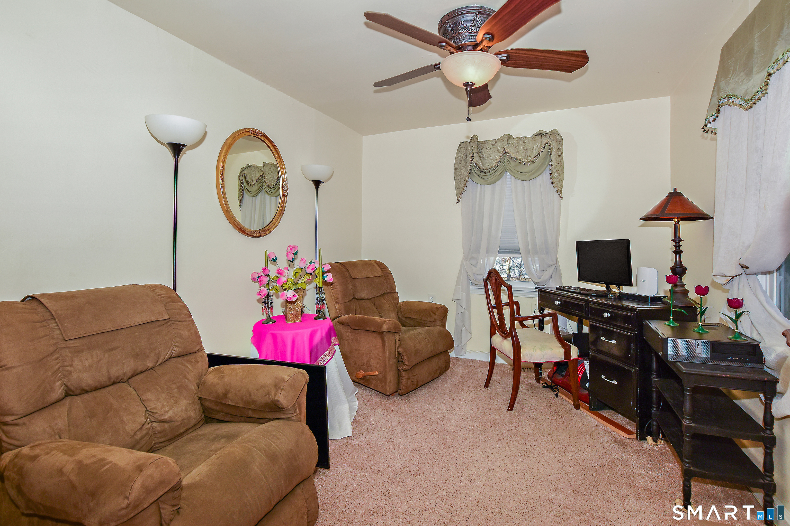 23 Victoria Street Griswold, CT 06351 - Photo 11 of 23 a living room with furniture a flat screen tv and a wall painting