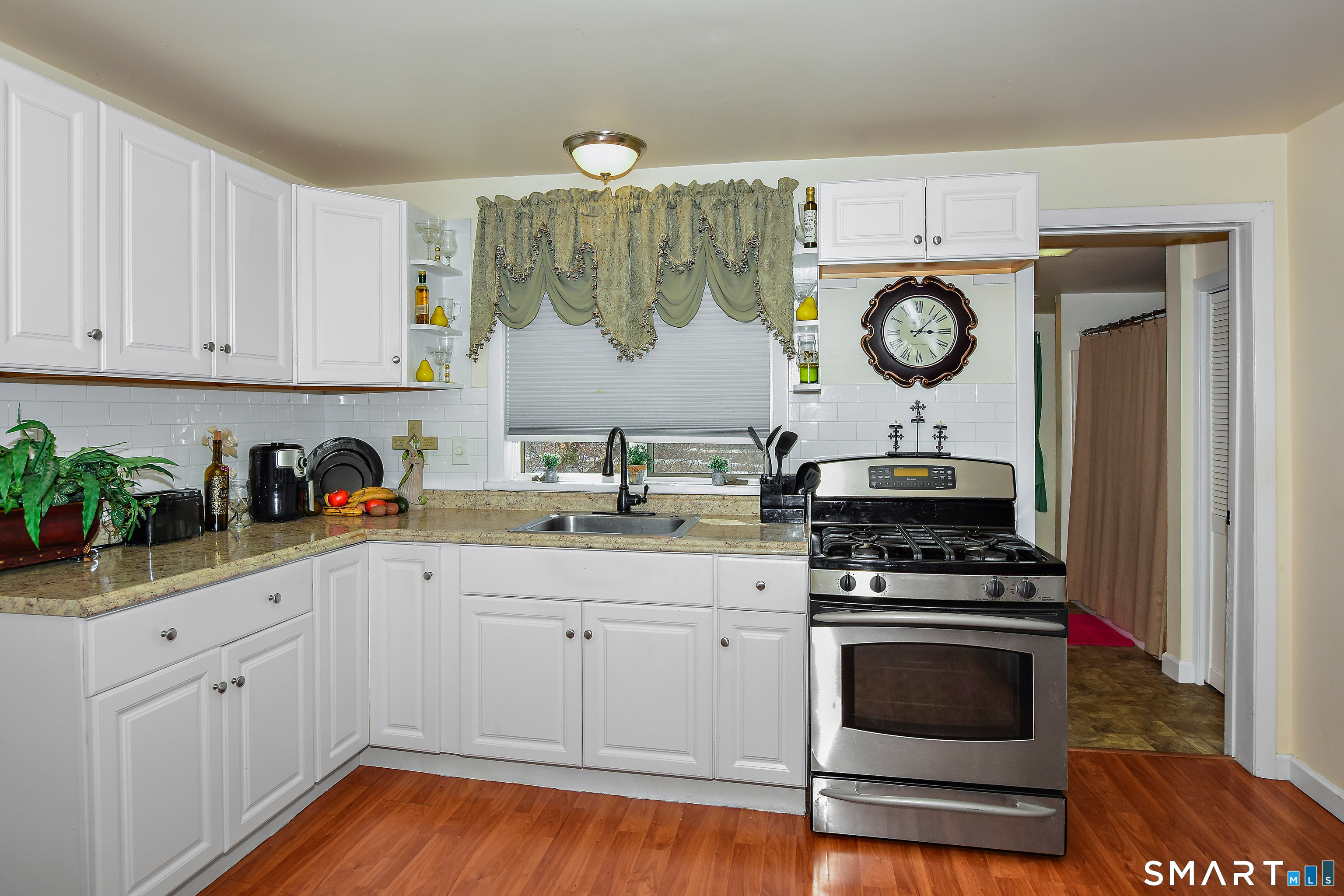23 Victoria Street Griswold, CT 06351 - Photo 7 of 23 a kitchen with a cabinets and wooden floor