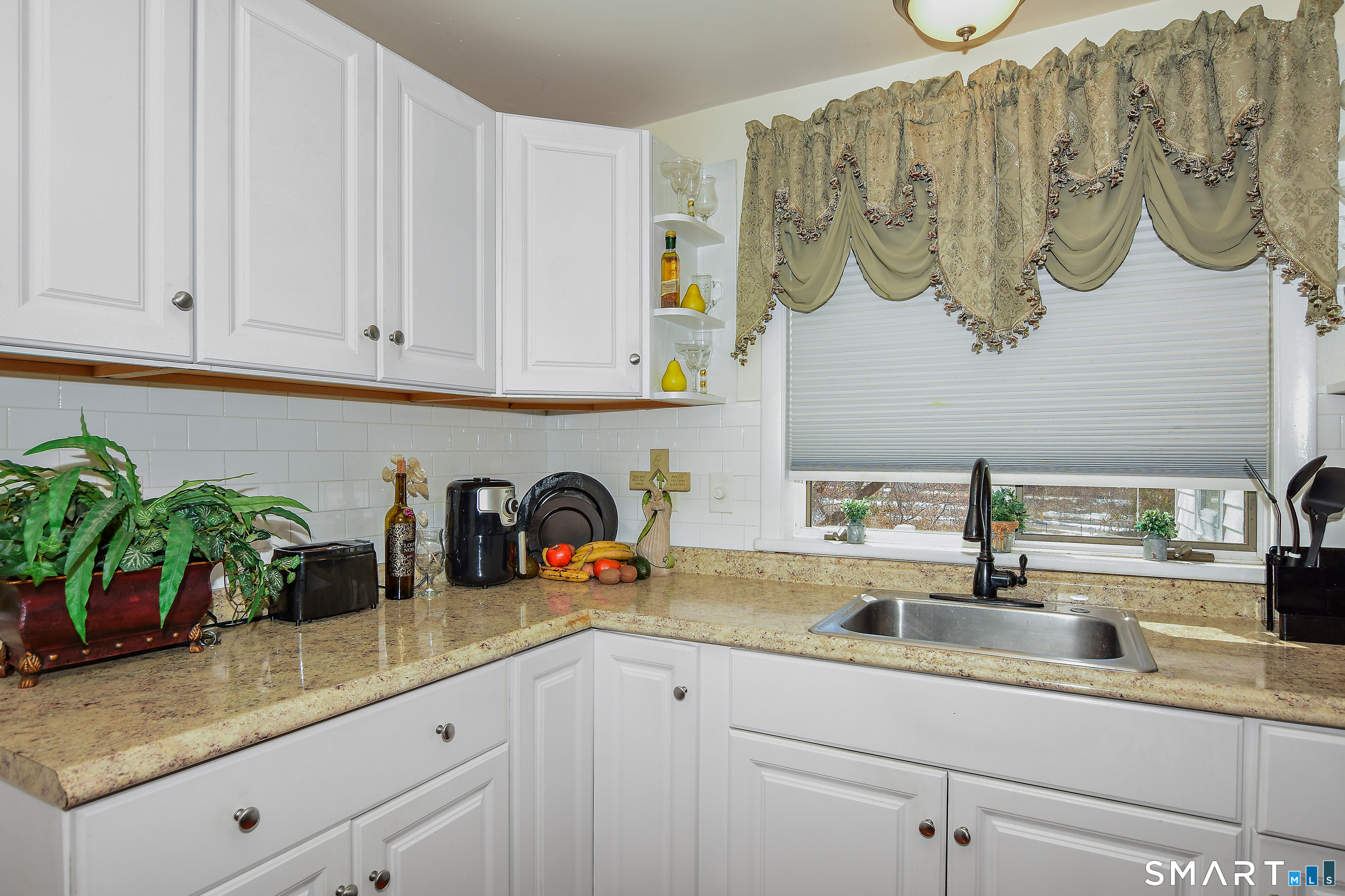 23 Victoria Street Griswold, CT 06351 - Photo 9 of 23 a kitchen with white cabinets a sink and a white wooden cabinets
