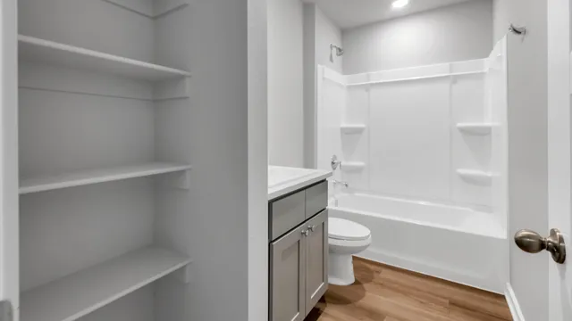 a bathroom with a bathtub and a toilet