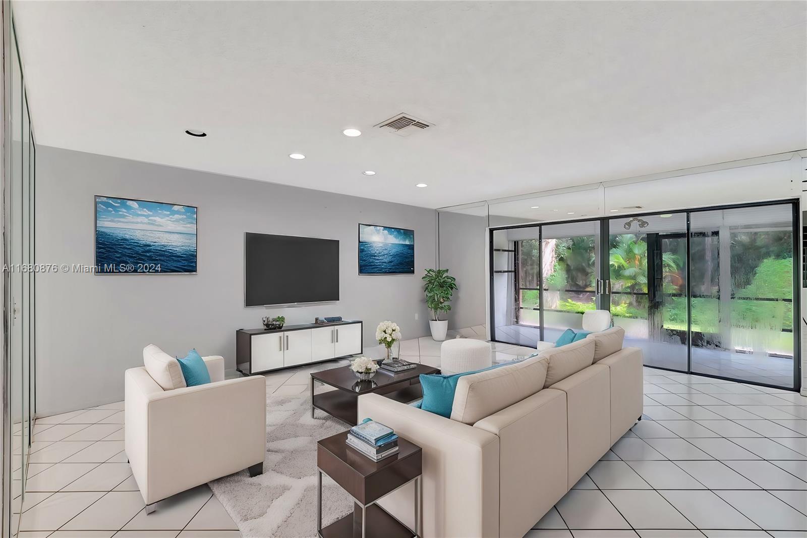 21864 Arriba Real, Unit 3E Boca Raton, FL 33433 - Photo 11 of 61 a living room with furniture and a flat screen tv