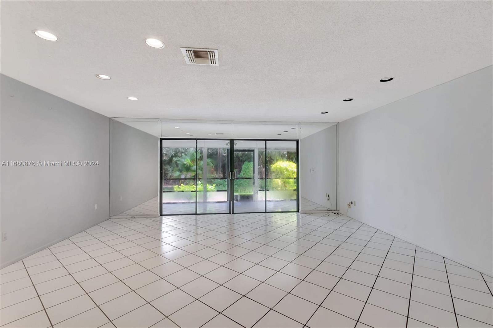 21864 Arriba Real, Unit 3E Boca Raton, FL 33433 - Photo 13 of 61 a view of an empty room with a window