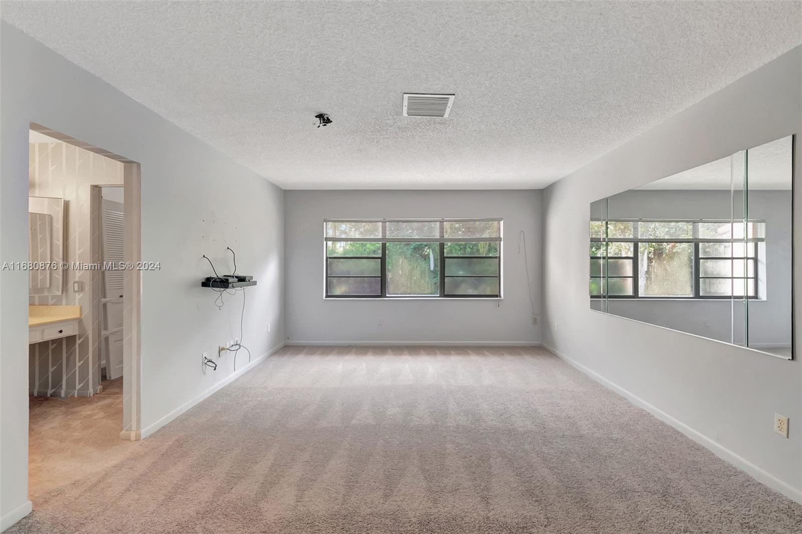 21864 Arriba Real, Unit 3E Boca Raton, FL 33433 - Photo 26 of 61 wooden floor in an empty room with a window
