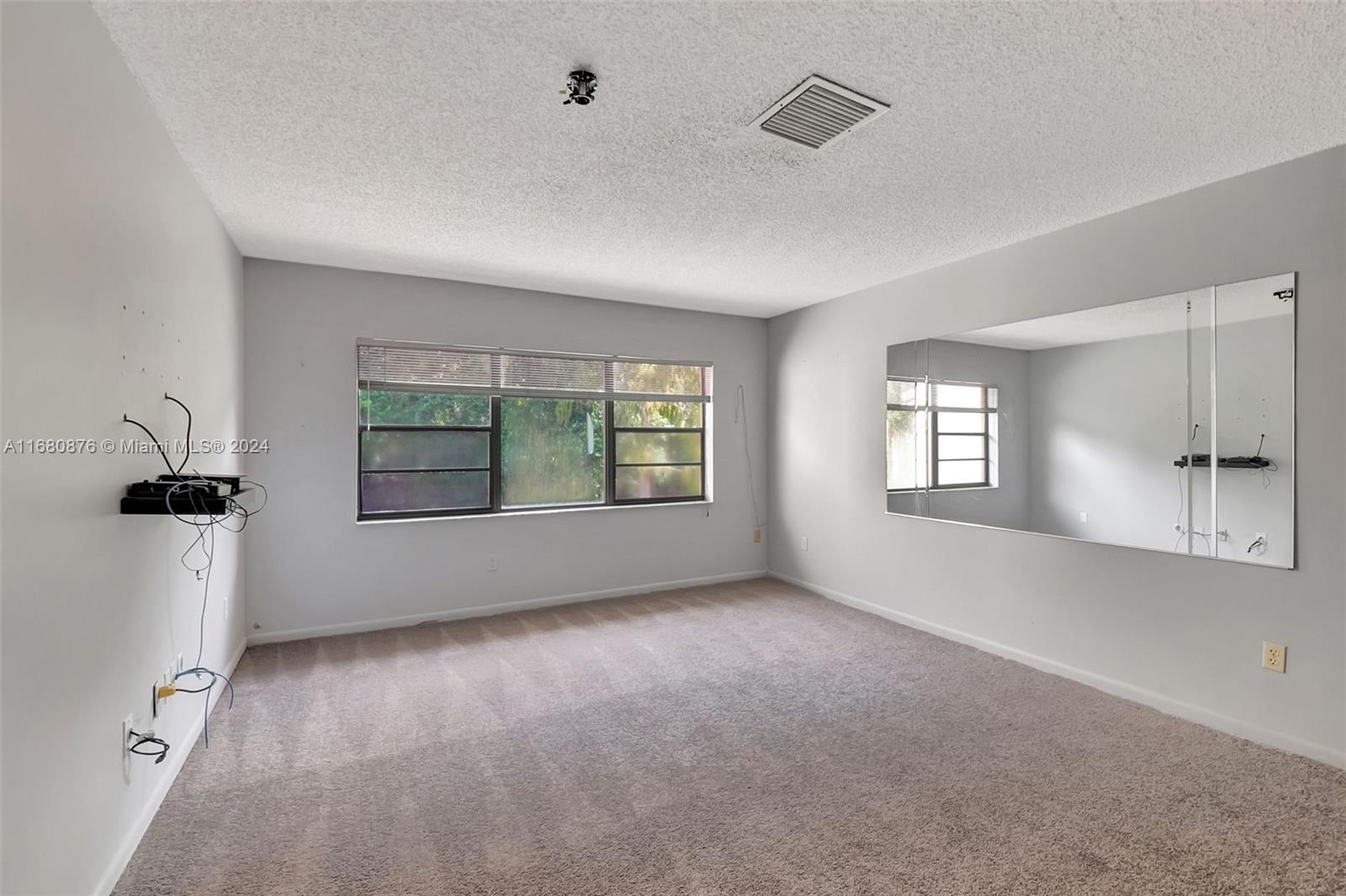 21864 Arriba Real, Unit 3E Boca Raton, FL 33433 - Photo 28 of 61 wooden floor in an empty room with a window