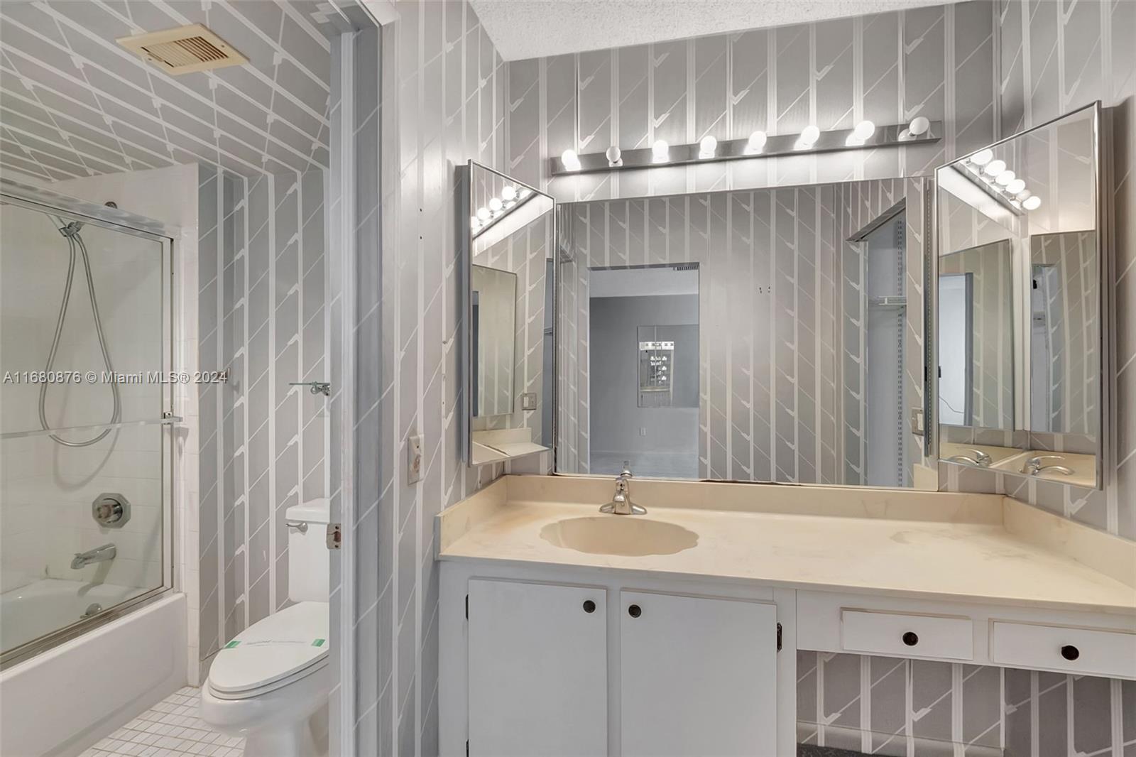 21864 Arriba Real, Unit 3E Boca Raton, FL 33433 - Photo 31 of 61 a bathroom with a sink a toilet and shower