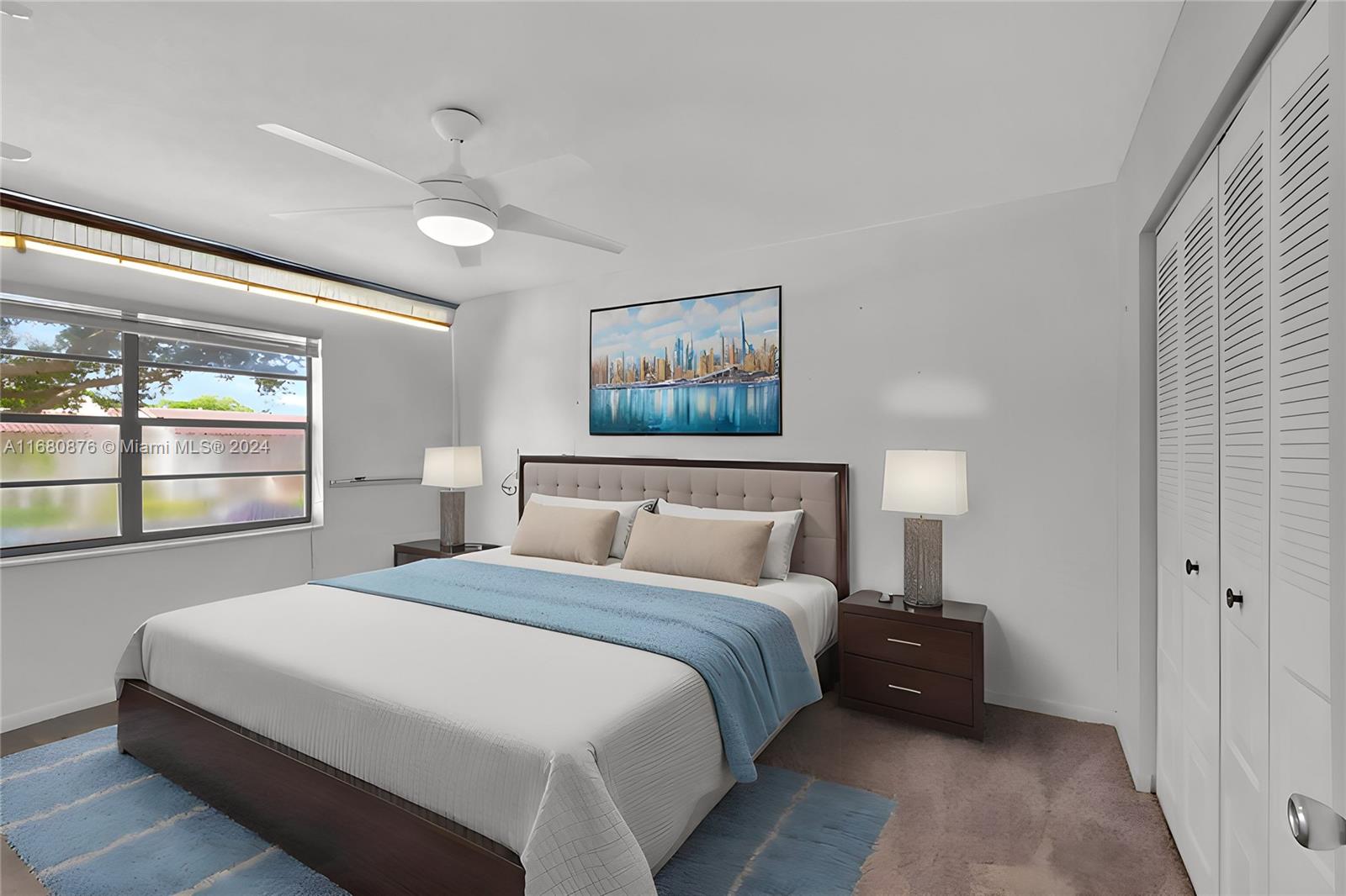 21864 Arriba Real, Unit 3E Boca Raton, FL 33433 - Photo 32 of 61 a bedroom with a bed and a painting on the wall