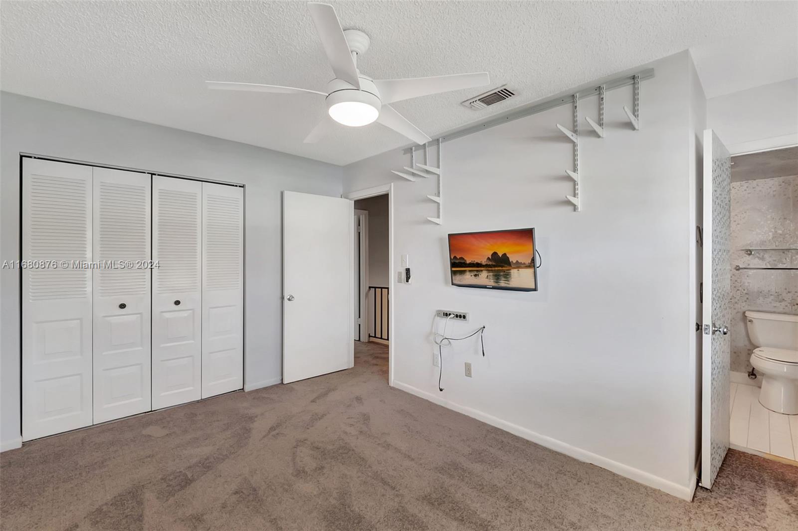 21864 Arriba Real, Unit 3E Boca Raton, FL 33433 - Photo 34 of 61 a view of a room with cabinet and mirror